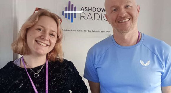 Man and Women smiling.