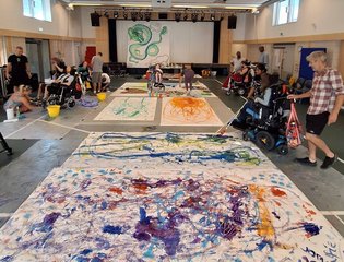 Colourful art sheets on the floor.