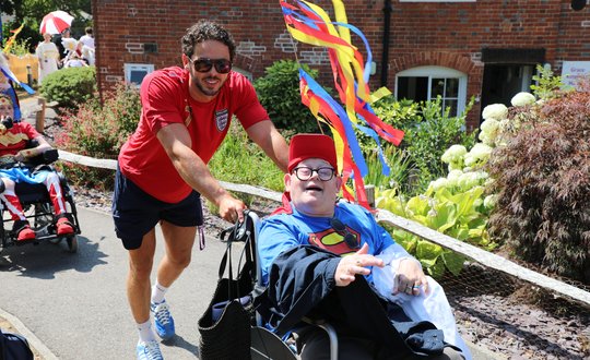Man smiling with his fitness instructor.
