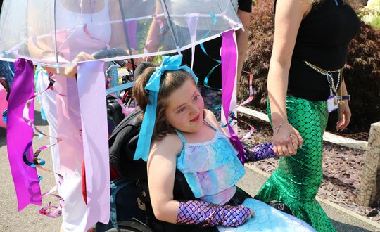 Young girl dressed as a mermaid.