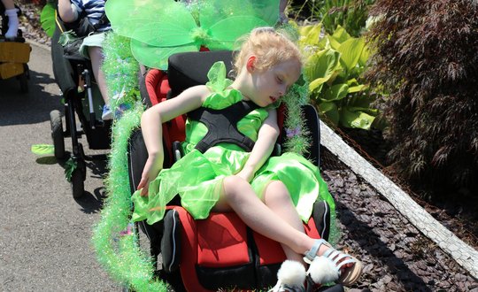 Young girl dressed as Tinkerbelle.
