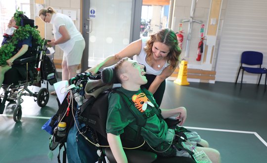 Boy Dancing with this support worker.