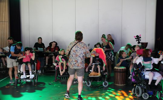Group of community customers preforming.