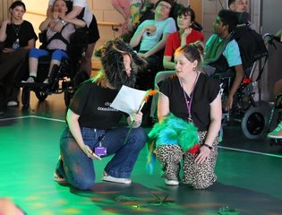 Two women dressed up performing.
