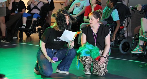 Two women dressed up performing.
