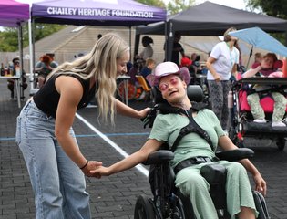 Two girls dancing at a festival.