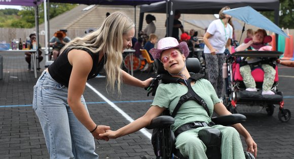 Two girls dancing at a festival.
