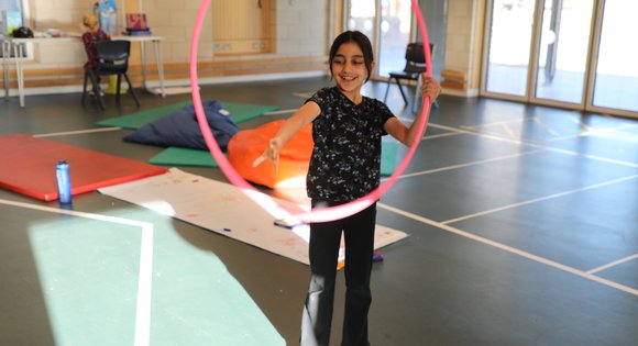 Young girl hoola hooping