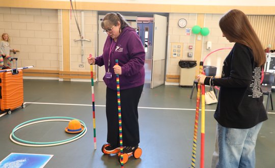 Adult and child practicing circus skills