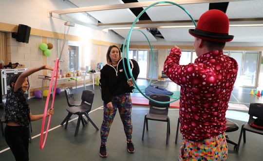 Lady and Circus performer practicing skills