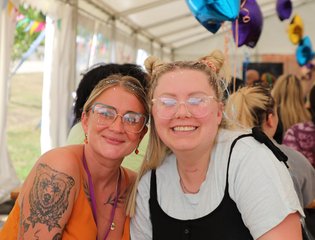 Two women smiling together.