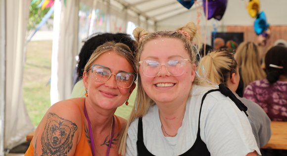 Two women smiling together.