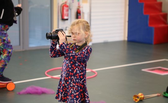 young girl with camera