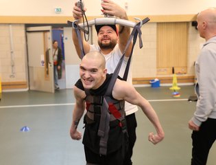 Man in standing sling.