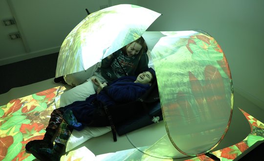 Young person interacting with virtual floor.