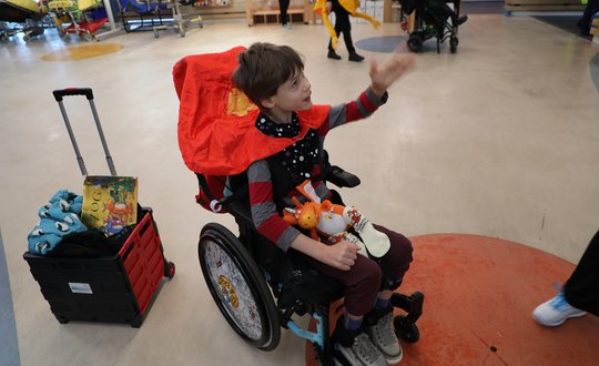 Boy dressed as a superhero.