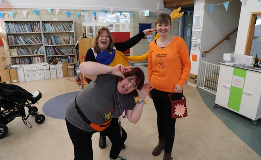 Three women dressed as mr men.