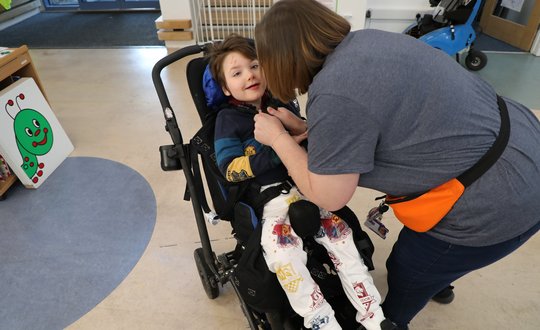 Young boy dressed as harry potter.