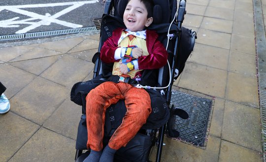 Young boy dressed as fantastic mr fox.