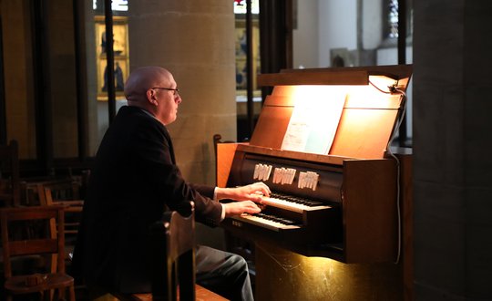 Man playing the organ.