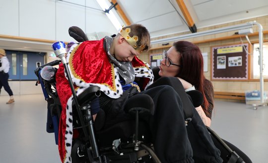 Boy dressed up as a king.