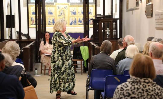 Women singing to the audience.