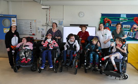 Class group photo all dressed up.