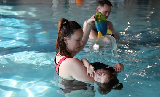 Young girl playing with water.