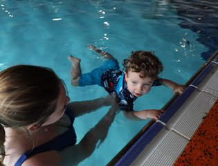 Child floating in the water.