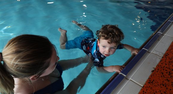 Child floating in the water.