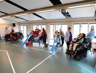 Group of people playing adaptive games.