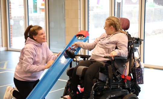 Girl playing adaptive curdling.