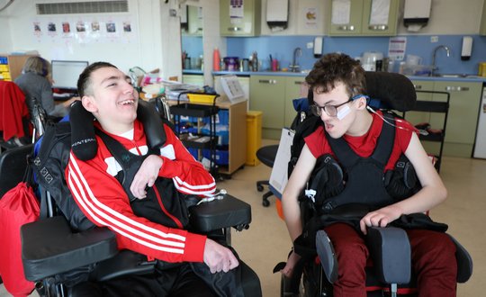 Two Boys dressed in red.