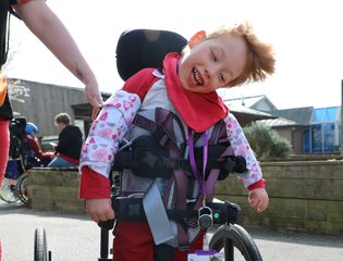 Boy smiling with red clothes.