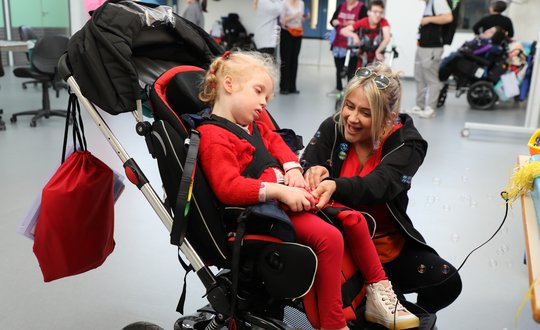 Young girl pressing switch with bubbles.