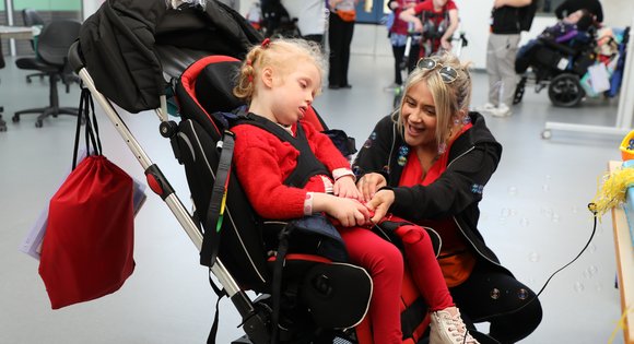 Young girl pressing switch with bubbles.