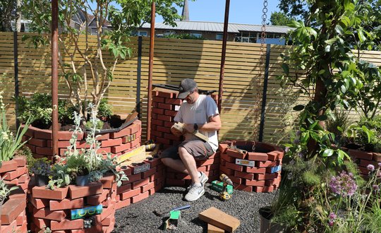A man building a garden.