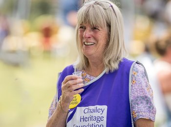 Volunteer trying a drink.