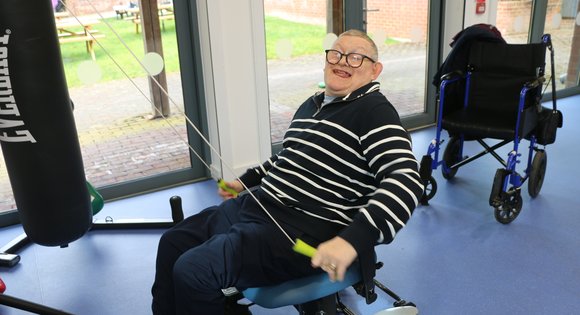 man using skiurg machine
