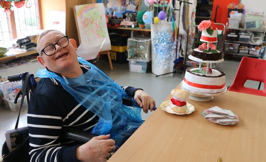 Customer with craft cake and painting scones