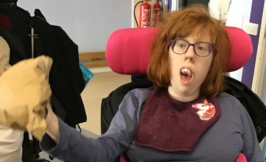 Girl playing with different textures.