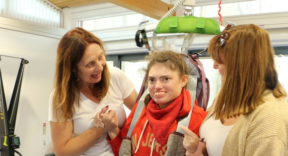 Young girl smiling on top of a step block.