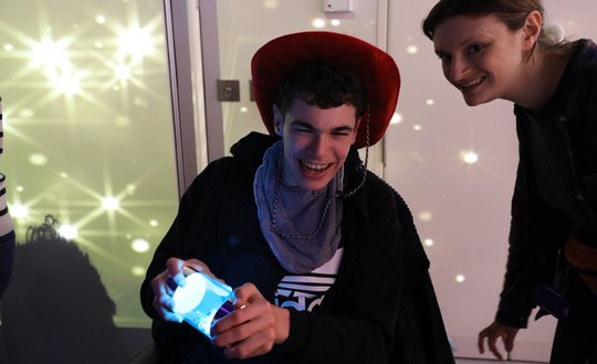 Boy playing with sensory lights.