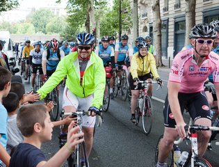 Cyclists passing supporters in France