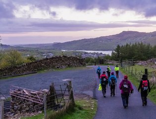Walkers descending from Snowdon at dawn