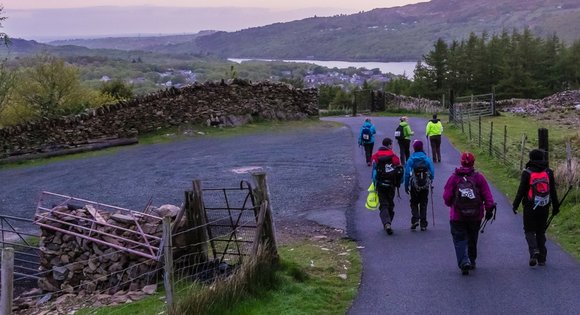 Walkers descending from Snowdon at dawn