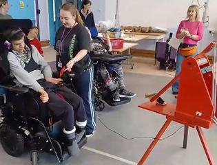 Catapult being used by a young person.