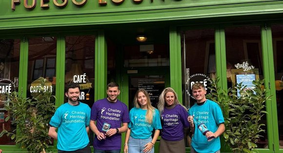Group of supporters wearing CHF branded t-shirts.