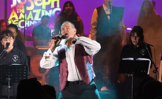 Man performing on stage.