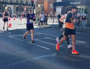 Girl running the Brighton marathon.